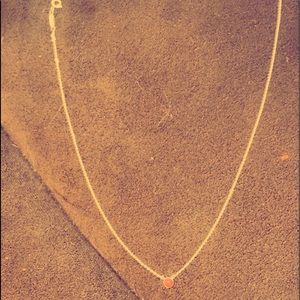 Only worn twice and from Tiffany’s. It’s white gold with an opal pendant.